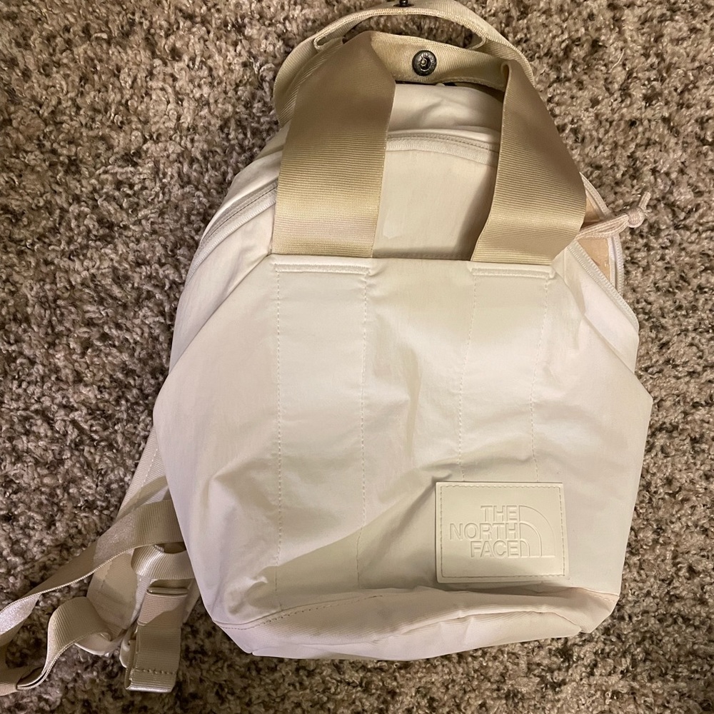 North face never stop mini backpack